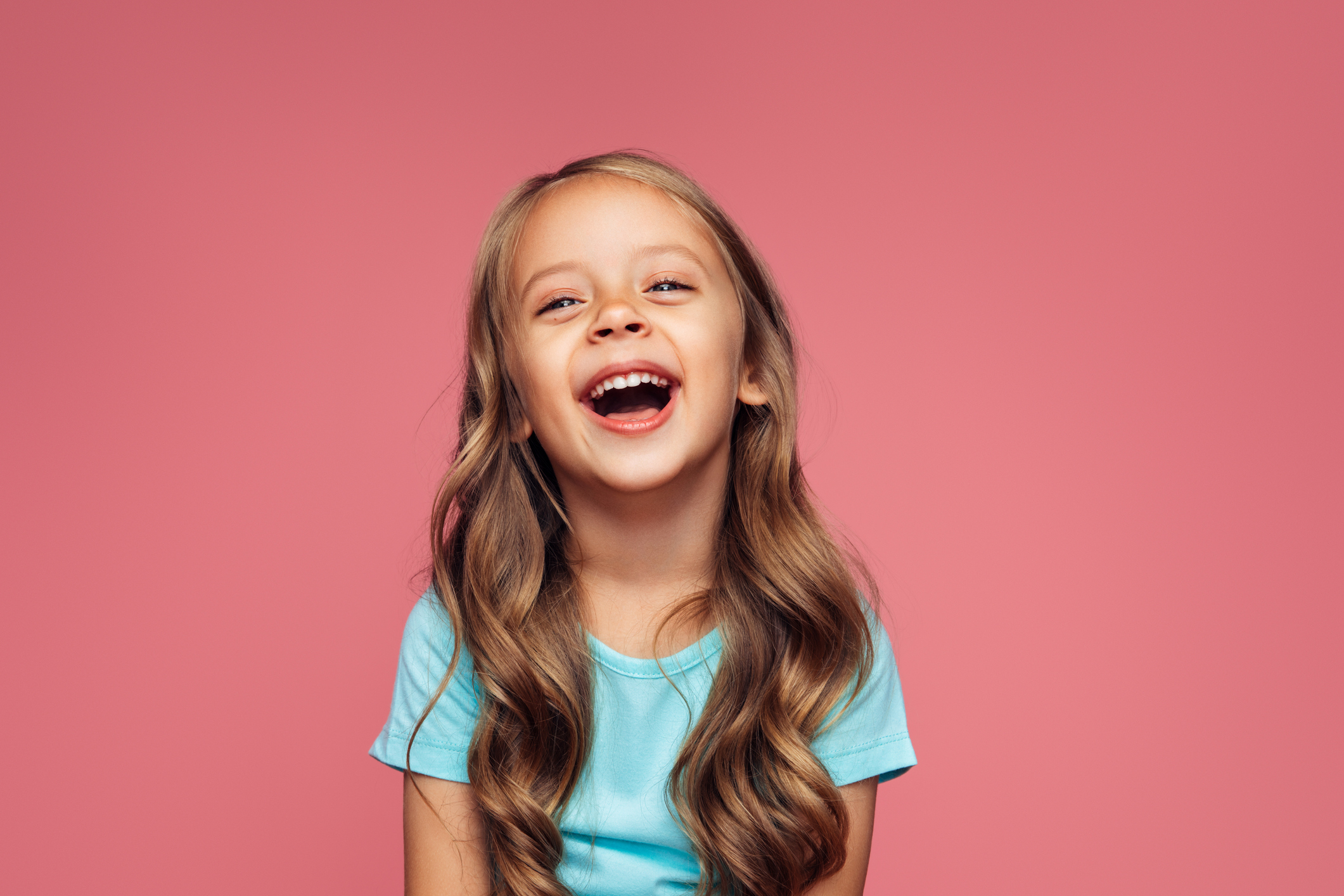 Funny girl on pink background