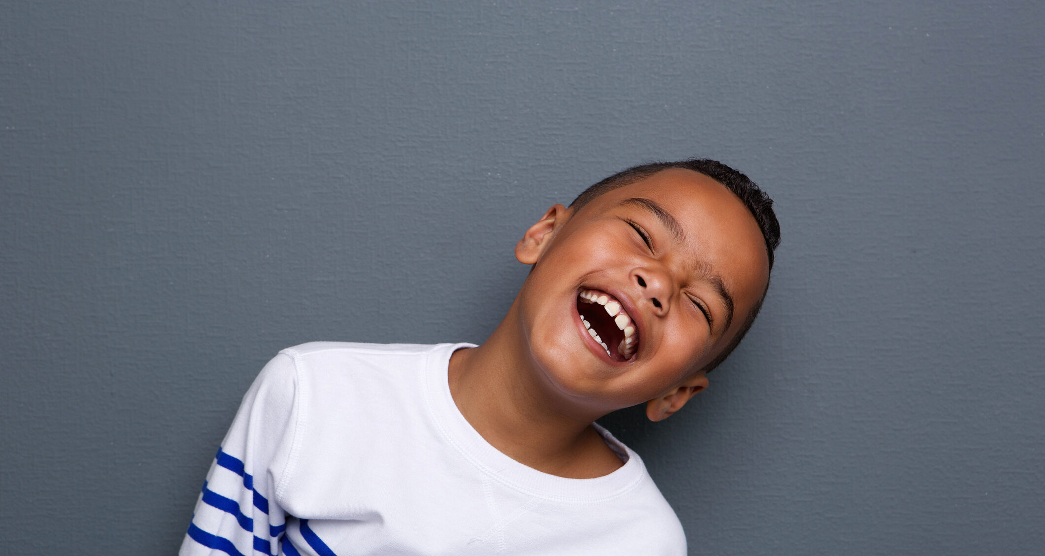 Close up portrait of a happy little boy smiling